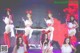 A group of girls in bunny costumes on stage.