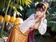 A woman in a kimono posing for a picture.